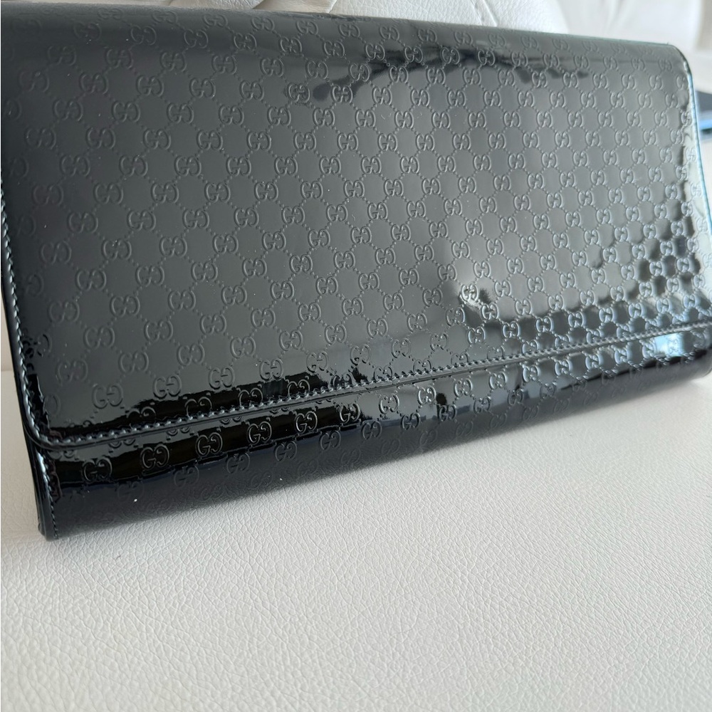 100% authentic Gucci black patent leather clutch